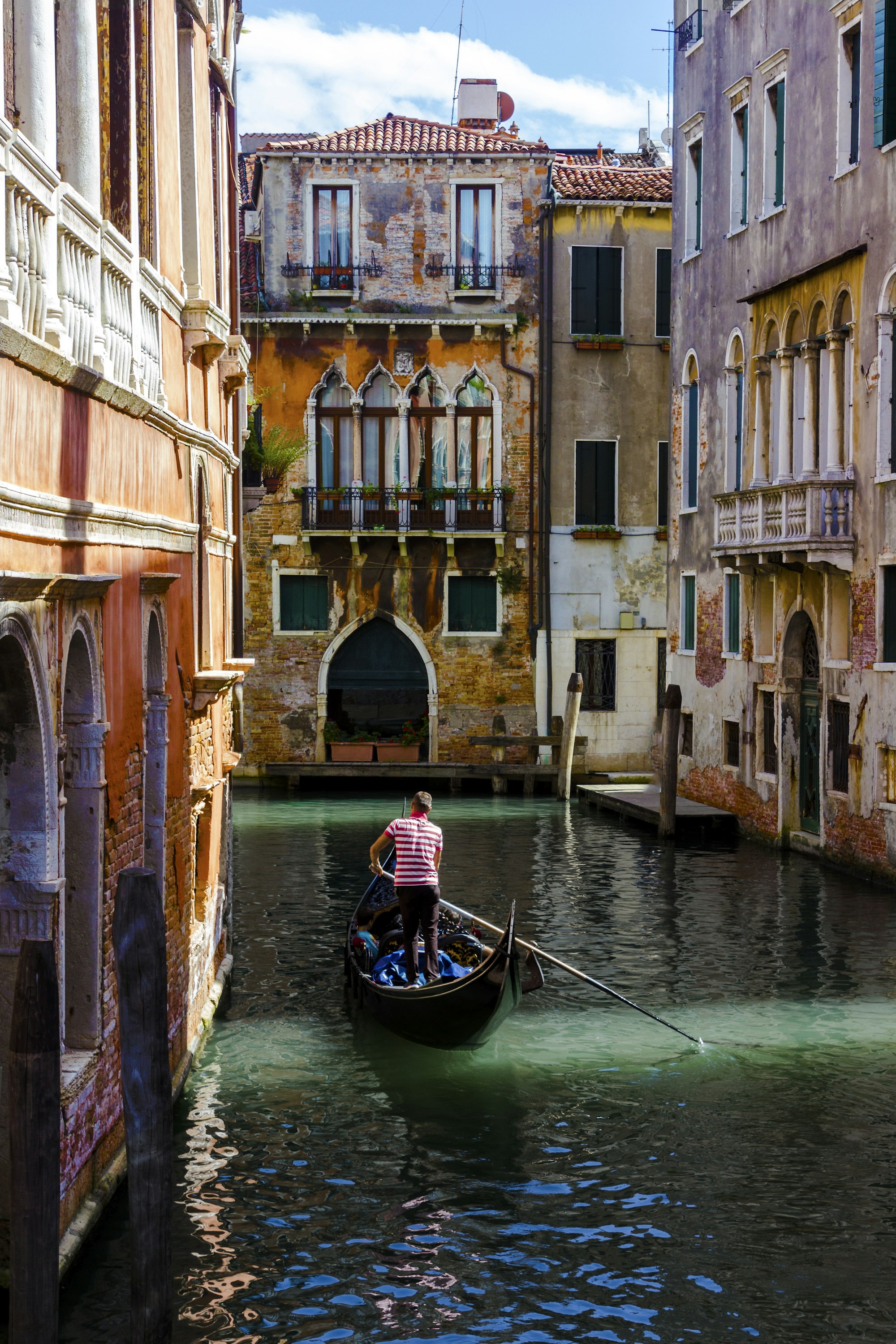 A boat between Venetian palazzi